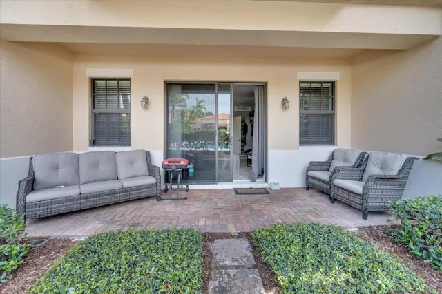 a view of a room with a floor to ceiling window and stairs