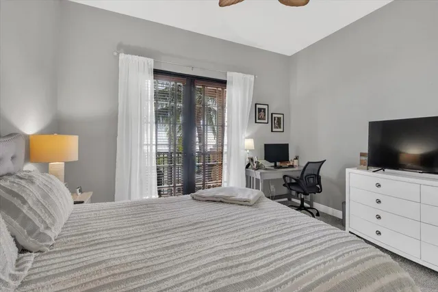 a bathroom with a granite countertop shower a sink and a mirror