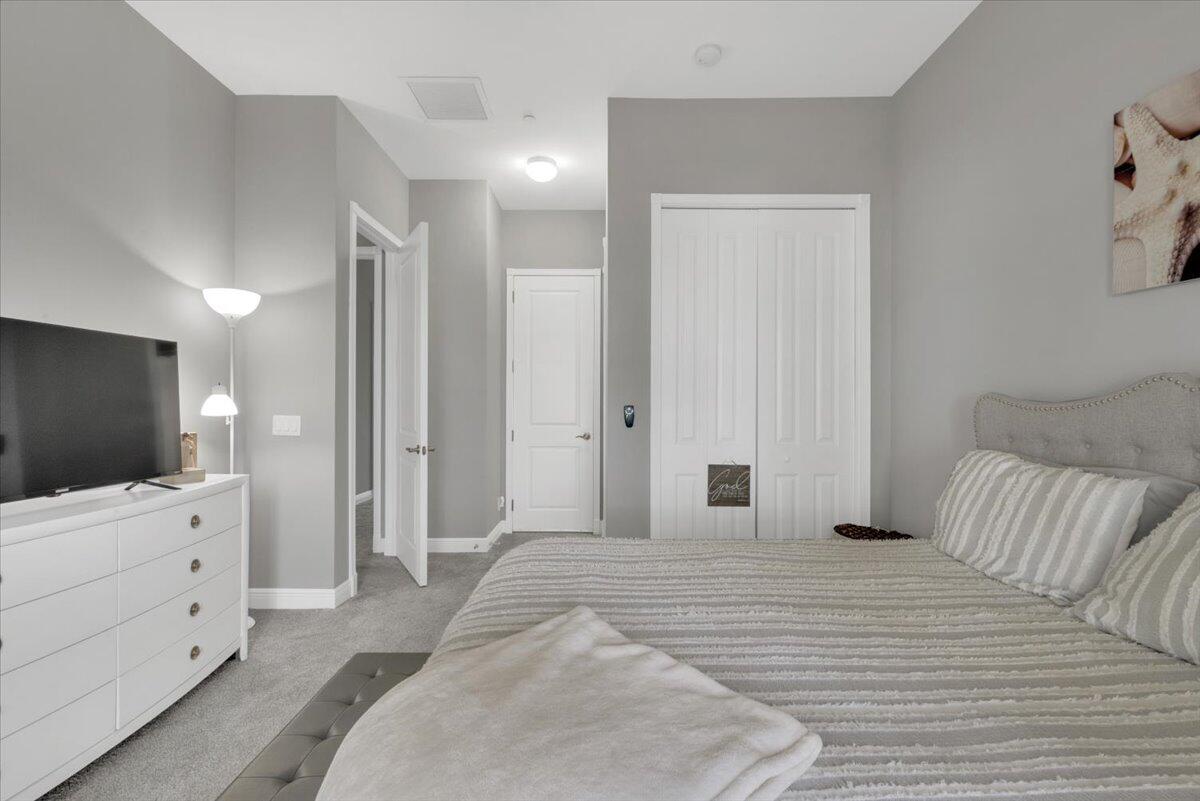 502 Del Sol Circle Tequesta, FL 33469 - Photo 47 of 73 a bedroom with a bed and a flat screen tv