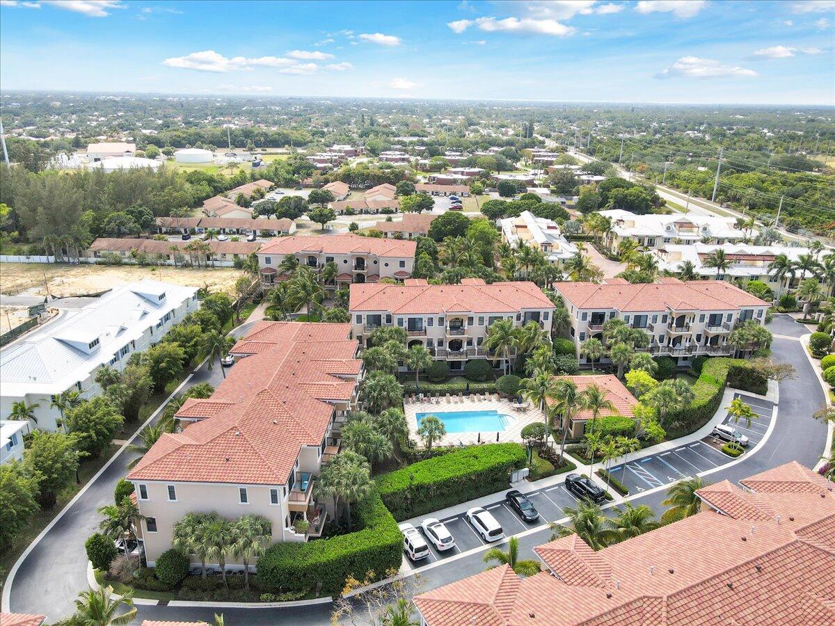 502 Del Sol Circle Tequesta, FL 33469 - Photo 70 of 73 an aerial view of residential houses with outdoor space and street view