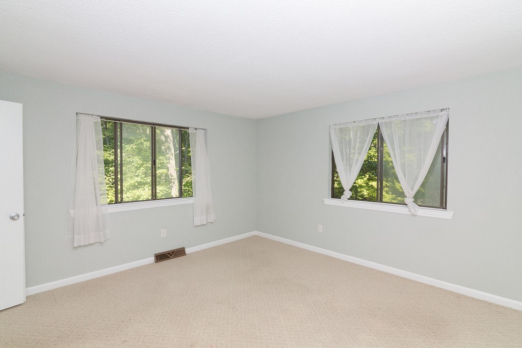 39 Mountain Gate Road, Unit 39 Ashland, MA 01721 - Photo 18 of 30 an empty room with windows
