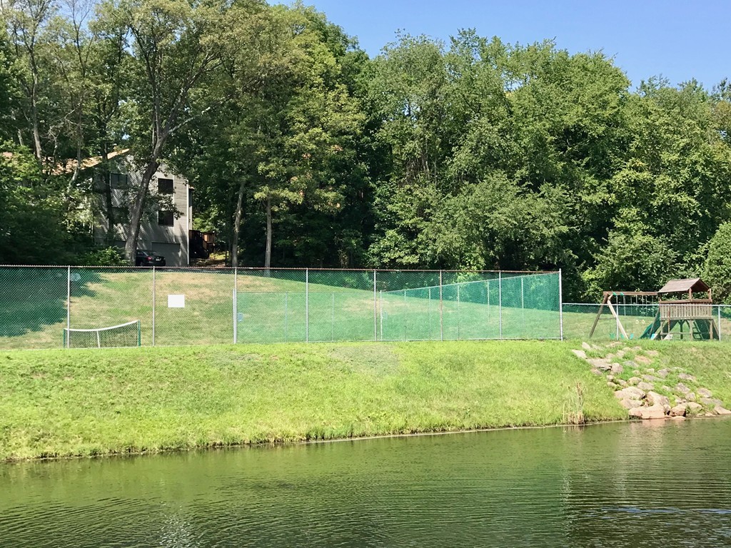39 Mountain Gate Road, Unit 39 Ashland, MA 01721 - Photo 27 of 30 a swimming pool with outdoor seating and yard