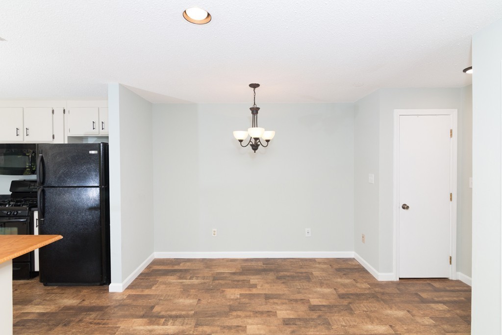 39 Mountain Gate Road, Unit 39 Ashland, MA 01721 - Photo 9 of 30 a view of a room with wooden floor