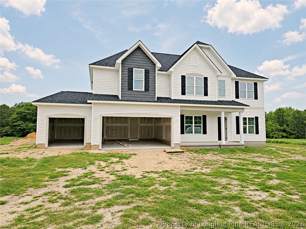 2650 Norrington Road Lillington, NC 27546 - Photo 20 of 24 a front view of a house with a yard