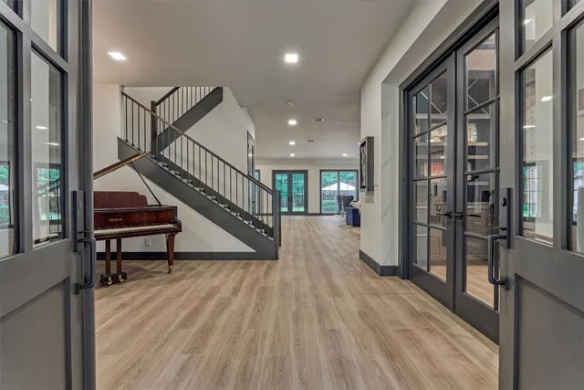 a view of entryway and hall with wooden floor