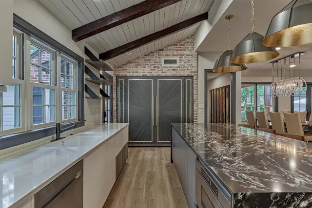 a view of a porch with a table and chairs