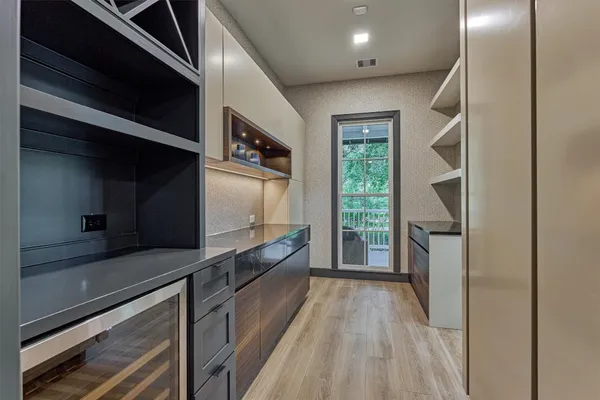 a view of a bathroom with a sink and mirror