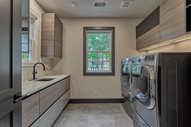 a utility room with cabinets