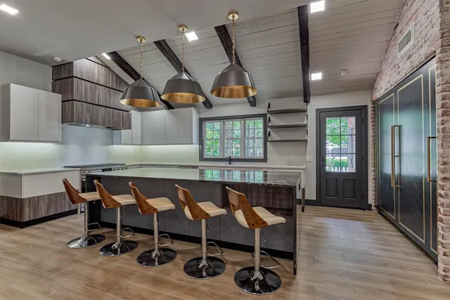 a dining room with furniture and wooden floor
