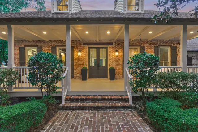 a front view of a house with a porch