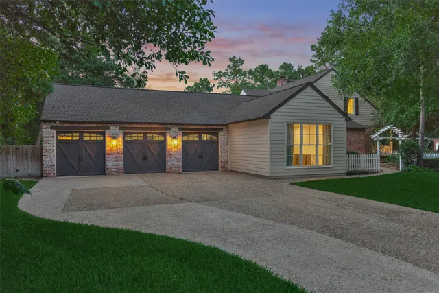 a front view of a house with garage