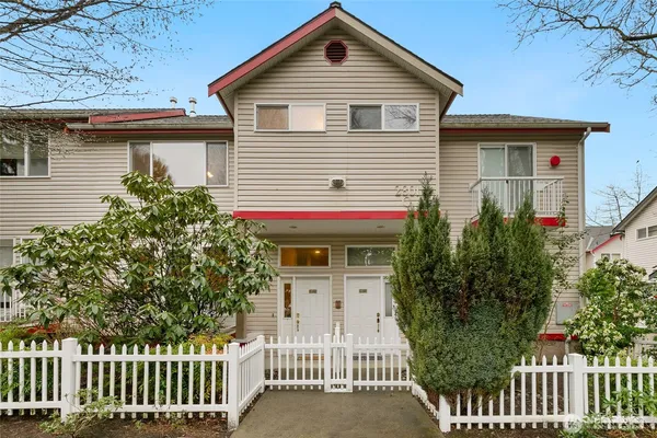a front view of a house with a fence