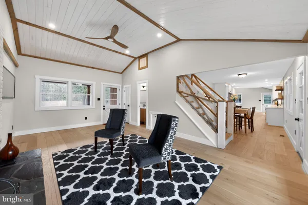 a living room with furniture and a rug