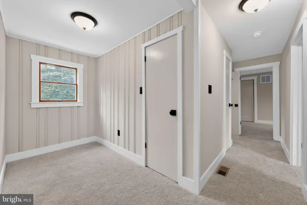 a view of a hallway with closet area