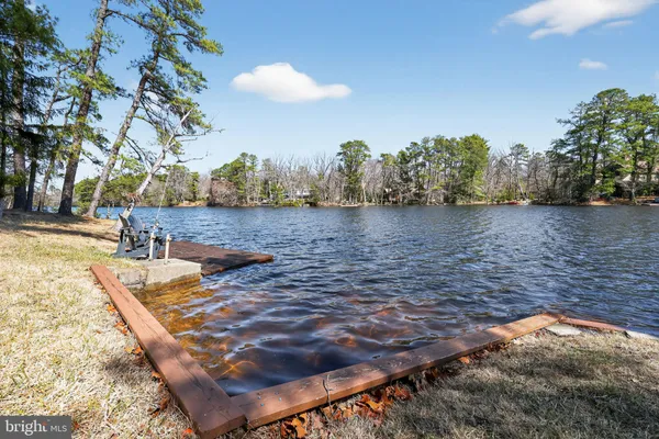 a view of a lake with furniture