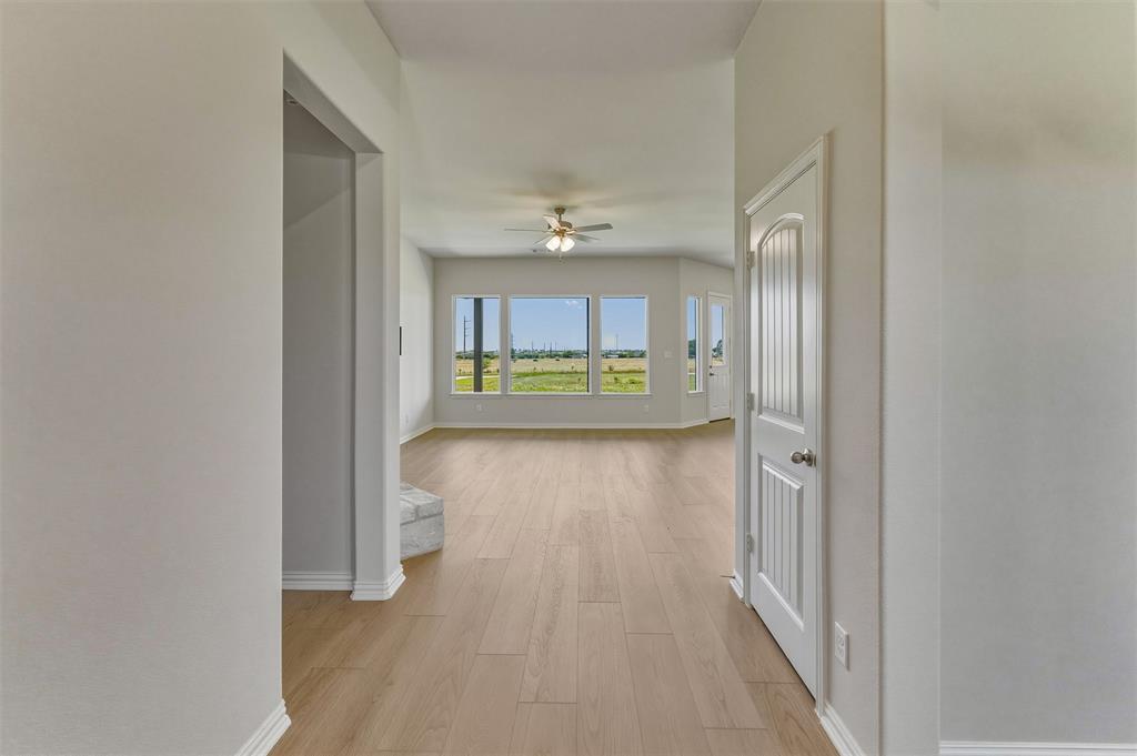 114 Hillview Trail Decatur, TX 76234 - Photo 5 of 27 Open concept living area with wood-finish flooring and abundant natural light