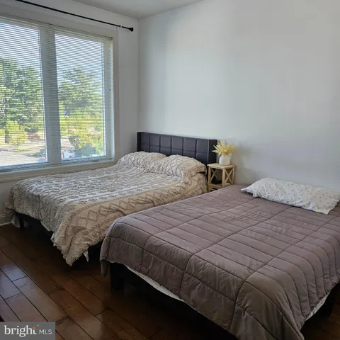 a bedroom with a bed and a lamp