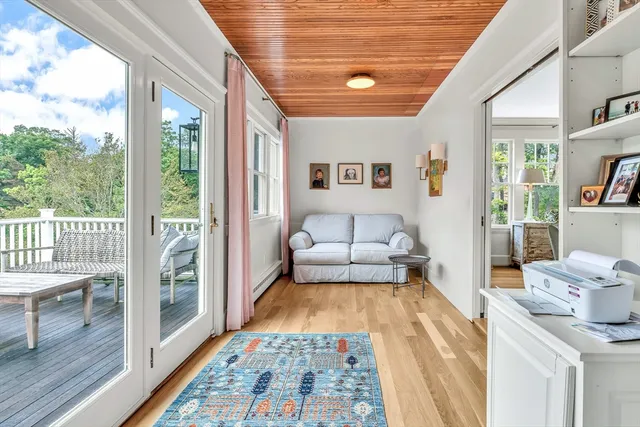 a bedroom with furniture and a rug