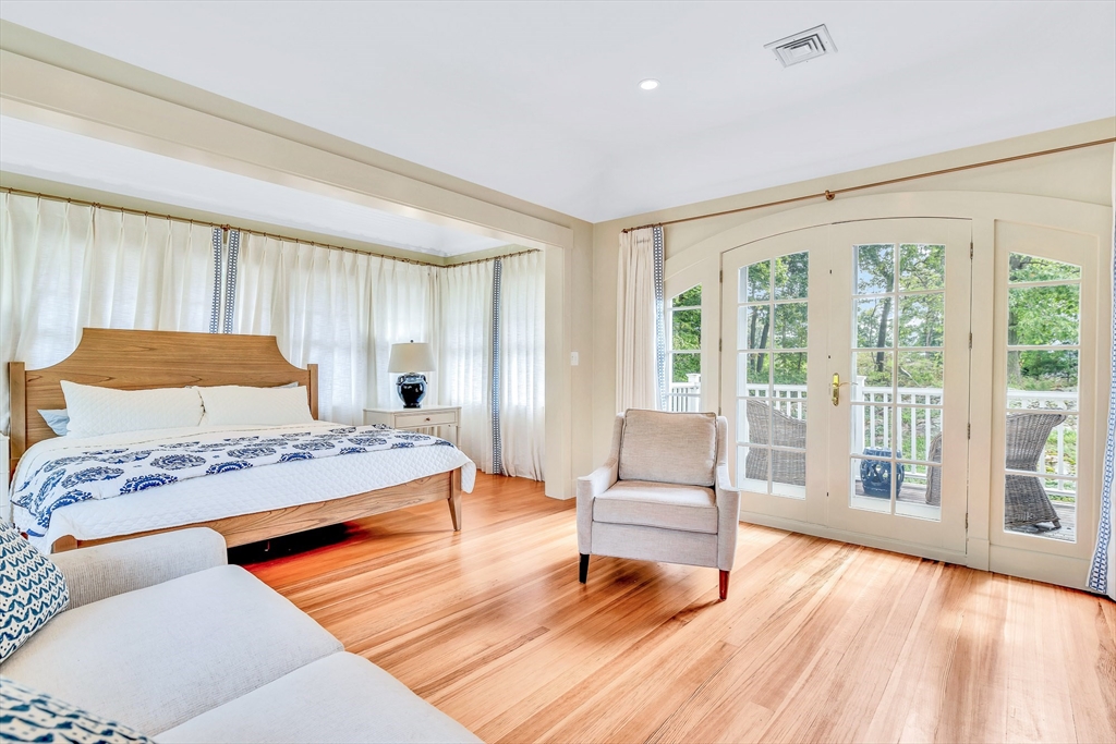 17 Atlantic Avenue, Unit MAIN HOUSE Cohasset, MA 02025 - Photo 15 of 22 a bedroom with a bed and a large window