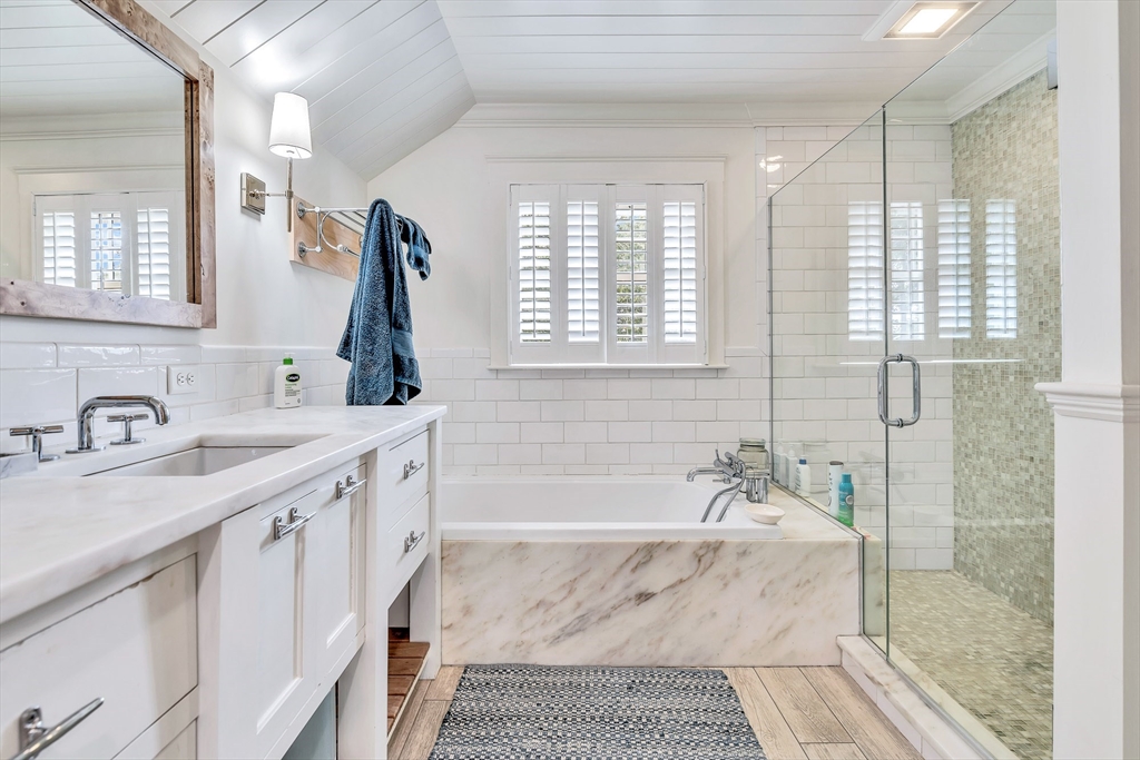 17 Atlantic Avenue, Unit MAIN HOUSE Cohasset, MA 02025 - Photo 18 of 22 a bathroom with a granite countertop sink a mirror and a shower