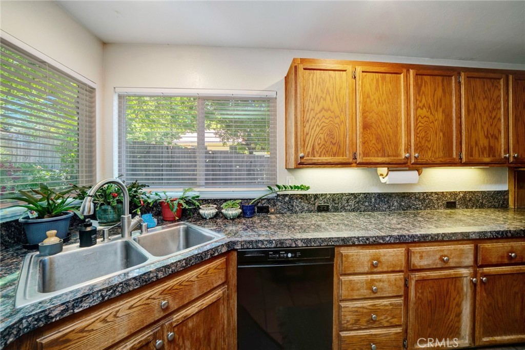 704 Old Meadow Valley Road Quincy, CA 95971 - Photo 15 of 38 a kitchen with granite countertop a sink and a window