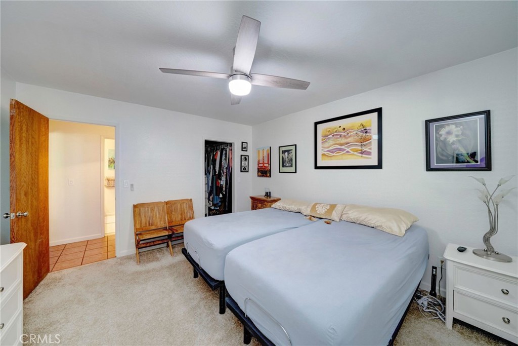 704 Old Meadow Valley Road Quincy, CA 95971 - Photo 19 of 38 a bedroom with a bed and a chandelier