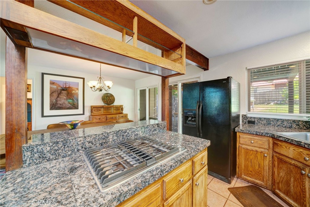 704 Old Meadow Valley Road Quincy, CA 95971 - Photo 9 of 38 a living room with stainless steel appliances kitchen island granite countertop a stove and cabinets