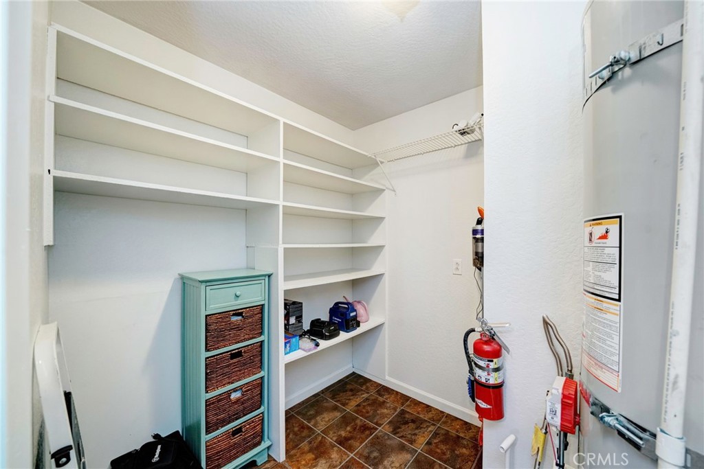 704 Old Meadow Valley Road Quincy, CA 95971 - Photo 10 of 38 a view of walk in closet with clothes and shoes