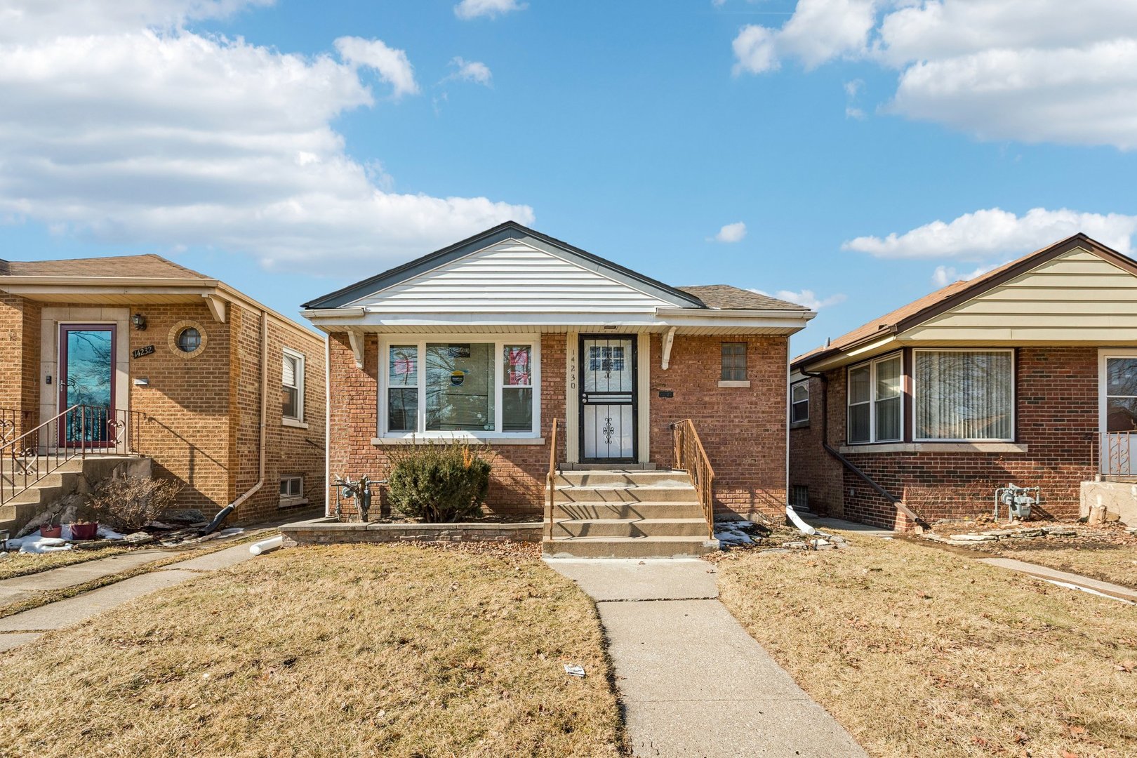 14230 South Normal Avenue Riverdale, IL 60827 - Photo 1 of 33 a front view of a house with a yard