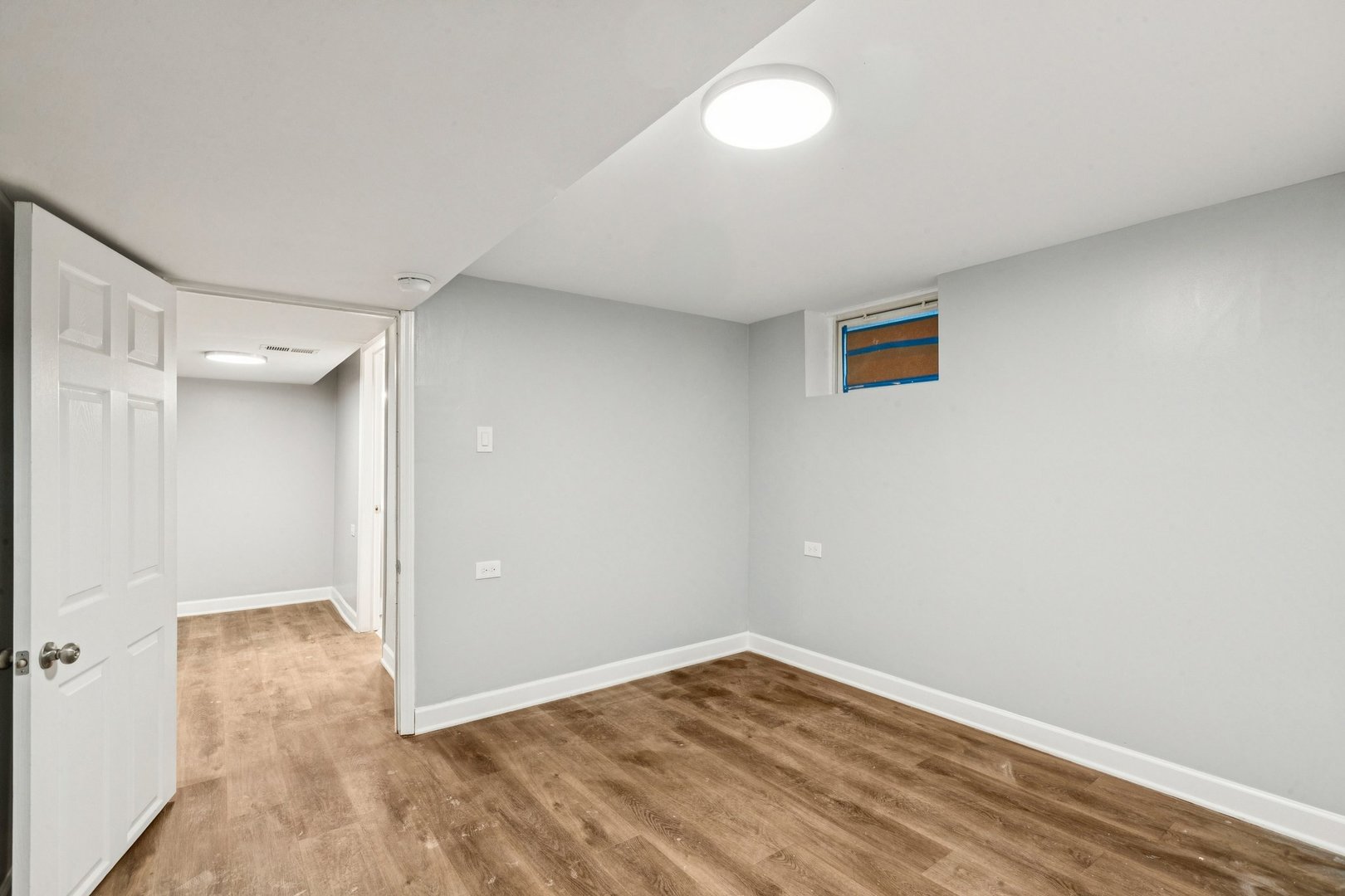 14230 South Normal Avenue Riverdale, IL 60827 - Photo 19 of 33 an empty room with wooden floor and windows