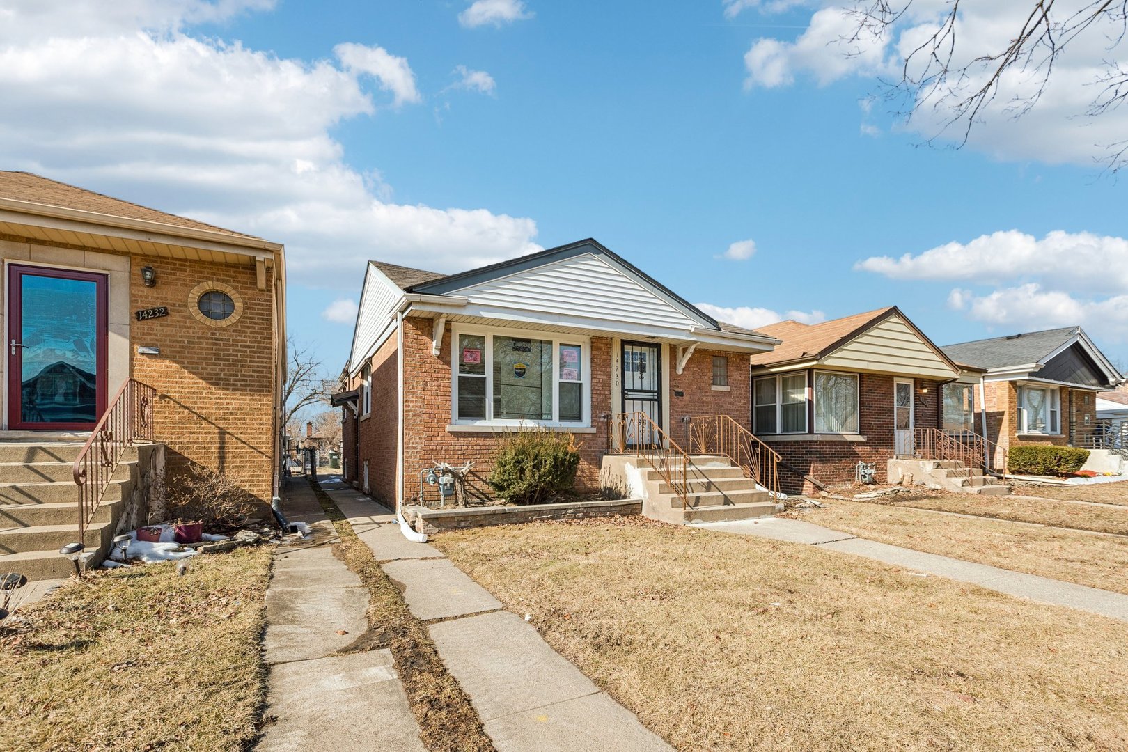 14230 South Normal Avenue Riverdale, IL 60827 - Photo 2 of 33 a front view of a house with snow on the background