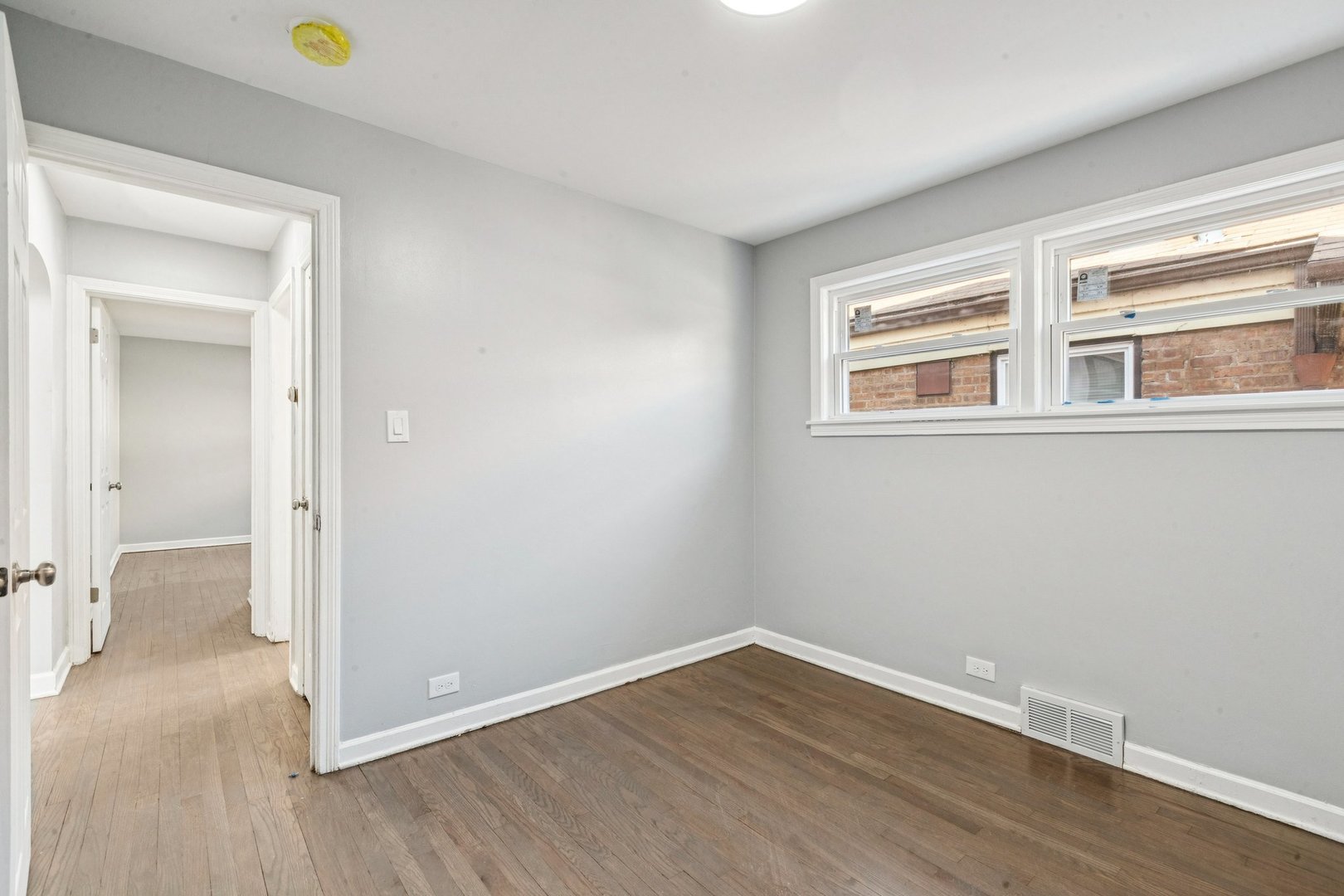 14230 South Normal Avenue Riverdale, IL 60827 - Photo 21 of 33 a view of a room with wooden floor and window