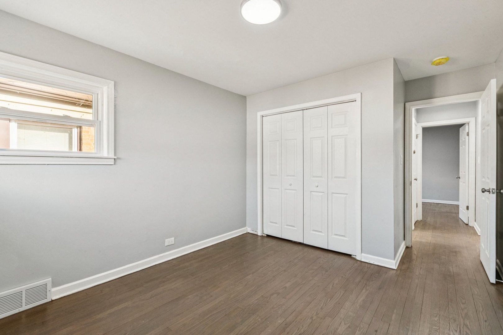 14230 South Normal Avenue Riverdale, IL 60827 - Photo 23 of 33 a view of an empty room with wooden floor and a window