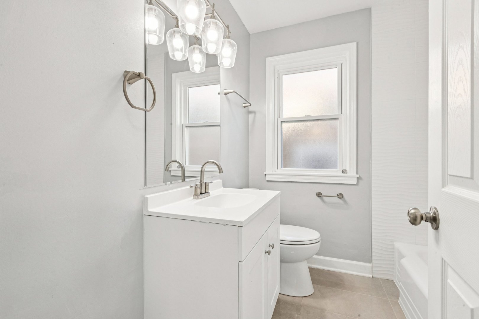 14230 South Normal Avenue Riverdale, IL 60827 - Photo 24 of 33 a bathroom with a sink a toilet and a mirror