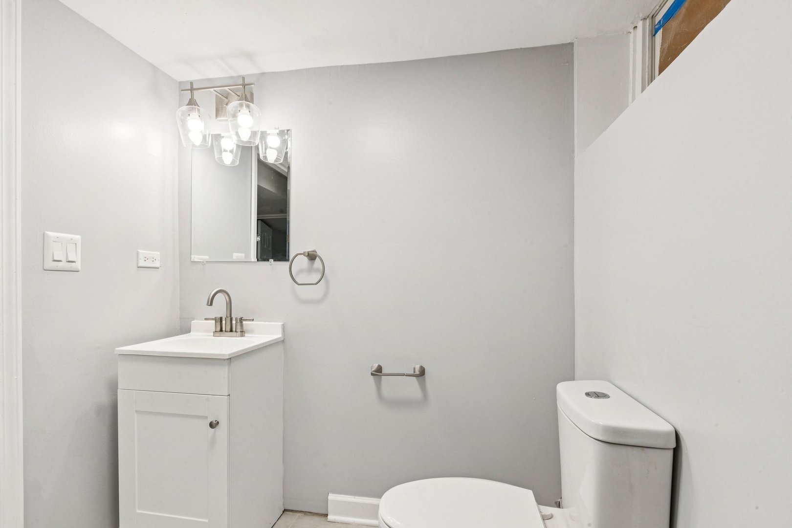 14230 South Normal Avenue Riverdale, IL 60827 - Photo 26 of 33 a bathroom with a toilet sink and mirror