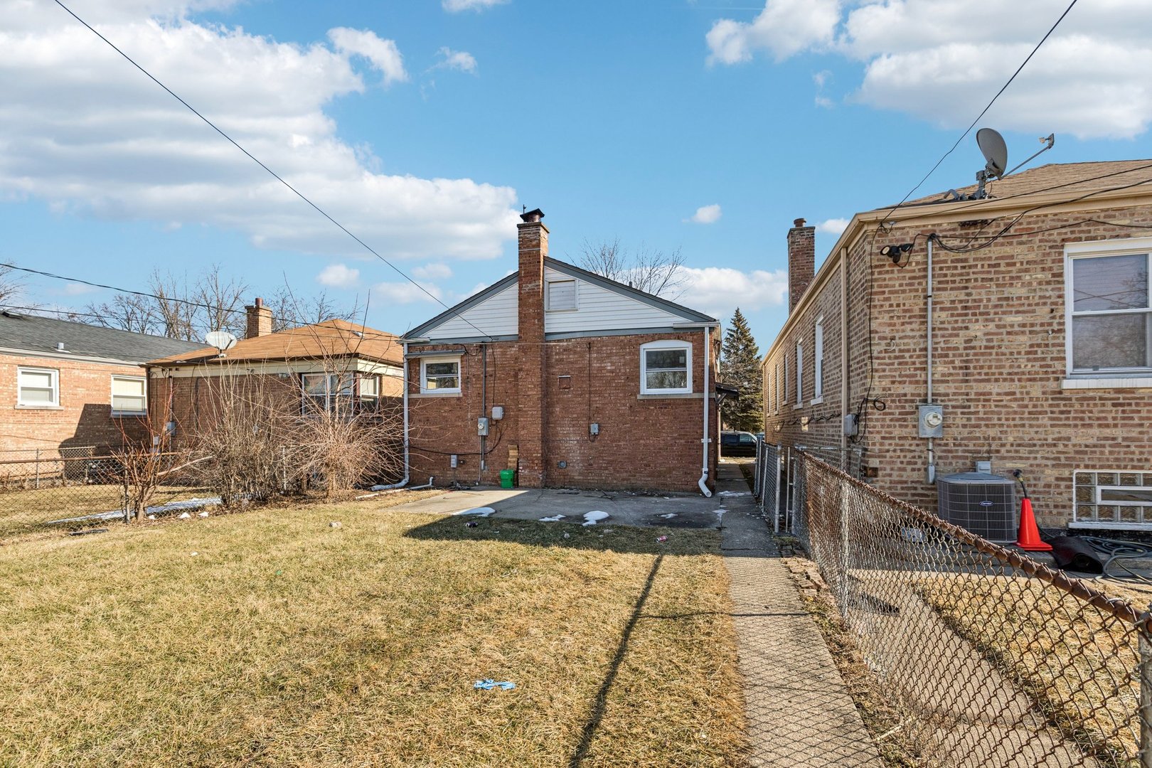 14230 South Normal Avenue Riverdale, IL 60827 - Photo 32 of 33 a view of a house with a backyard