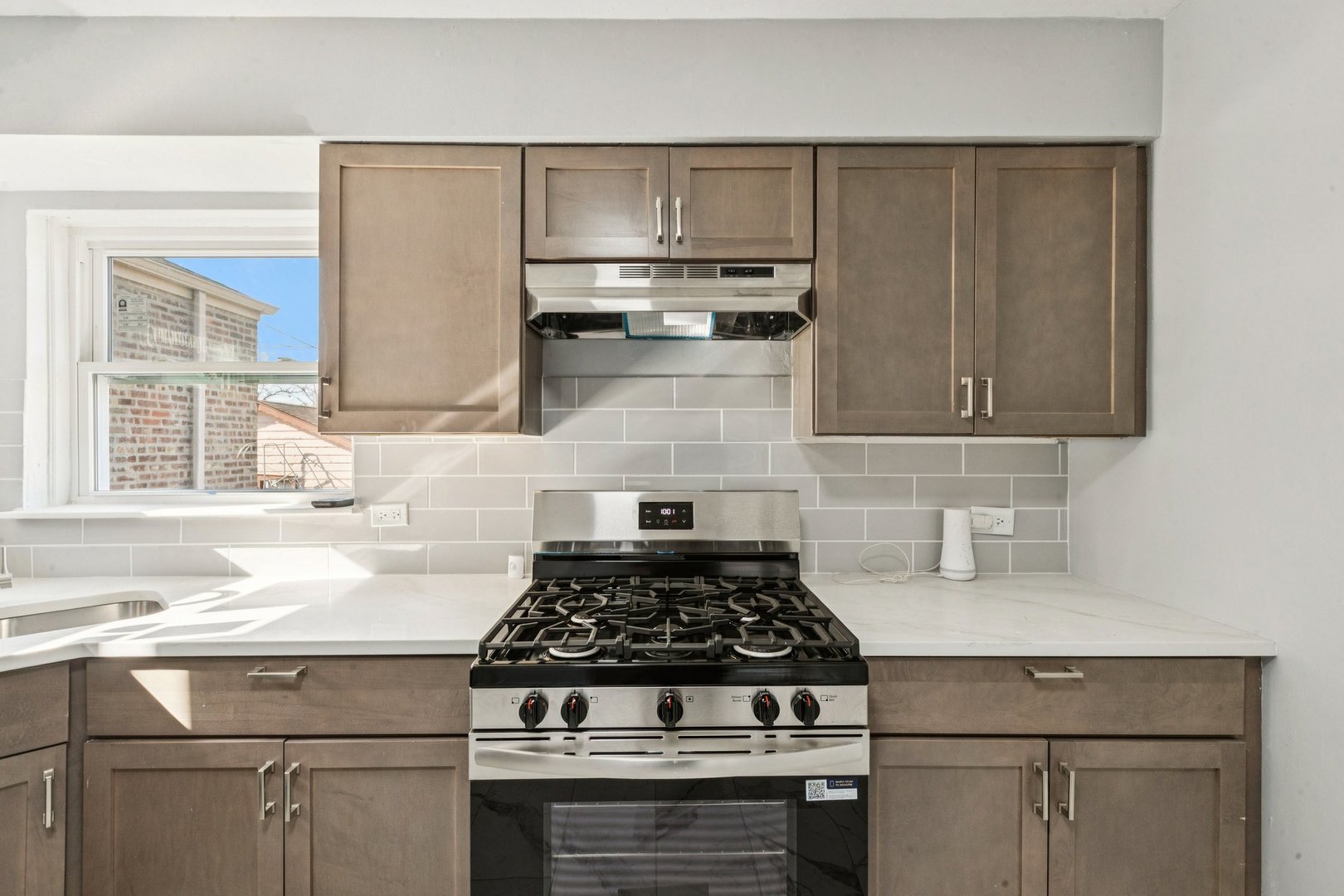14230 South Normal Avenue Riverdale, IL 60827 - Photo 6 of 33 a stove top oven sitting inside of a kitchen