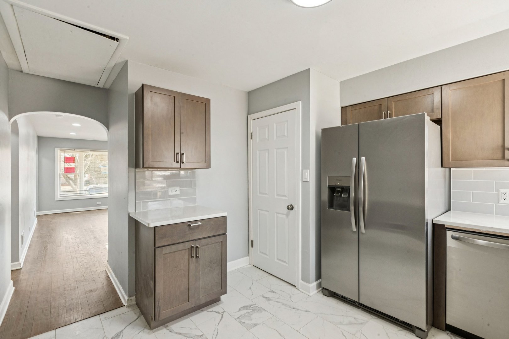 14230 South Normal Avenue Riverdale, IL 60827 - Photo 8 of 33 a kitchen with a refrigerator a sink and cabinets