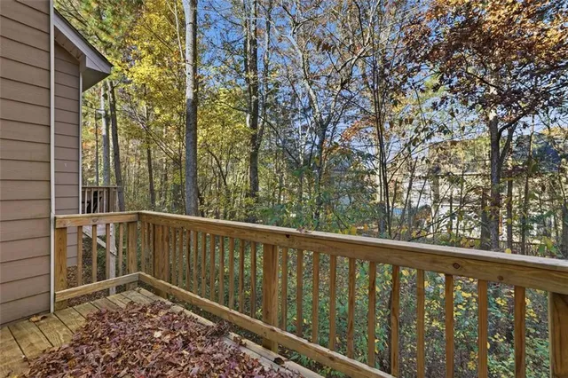 a view of a balcony with trees