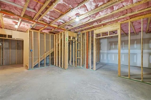 a view of an empty room with wooden walls