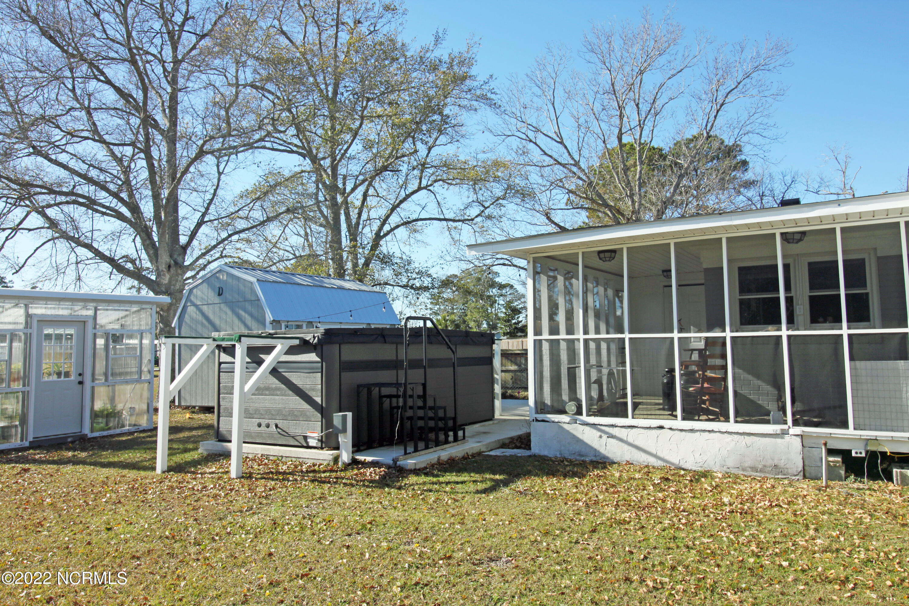 130 Hall Point Road Sneads Ferry, NC 28460 - Photo 20 of 29 Swim spa, shed, greenhouse and back porc