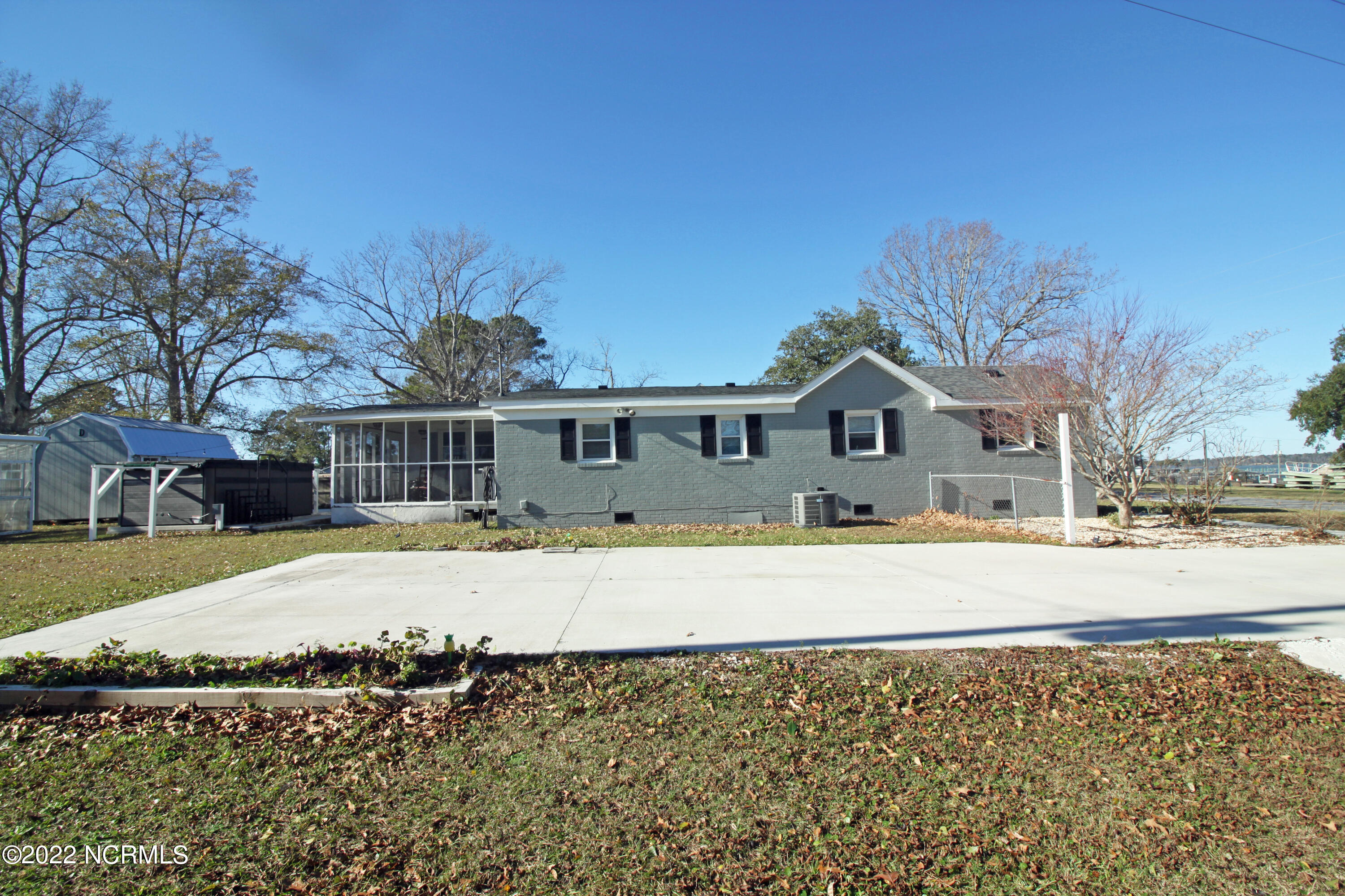 130 Hall Point Road Sneads Ferry, NC 28460 - Photo 5 of 29 Side of house and parking pad
