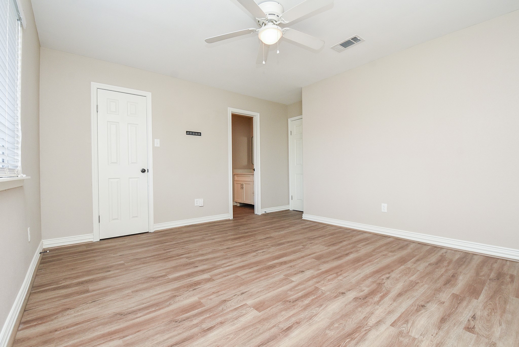 4606 Whispering Rock Lane Spring, TX 77388 - Photo 15 of 30 a view of an empty room with wooden floor