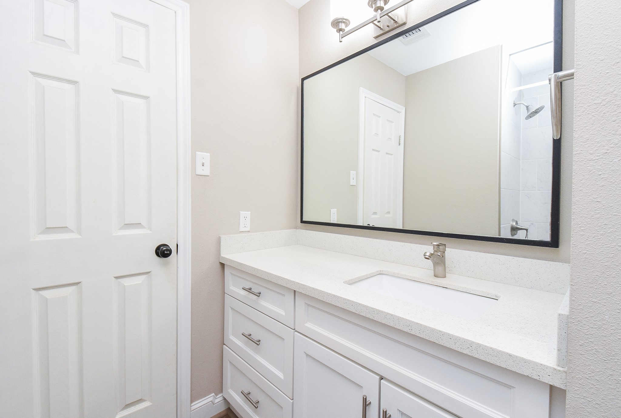 4606 Whispering Rock Lane Spring, TX 77388 - Photo 23 of 30 a bathroom with a sink and a mirror