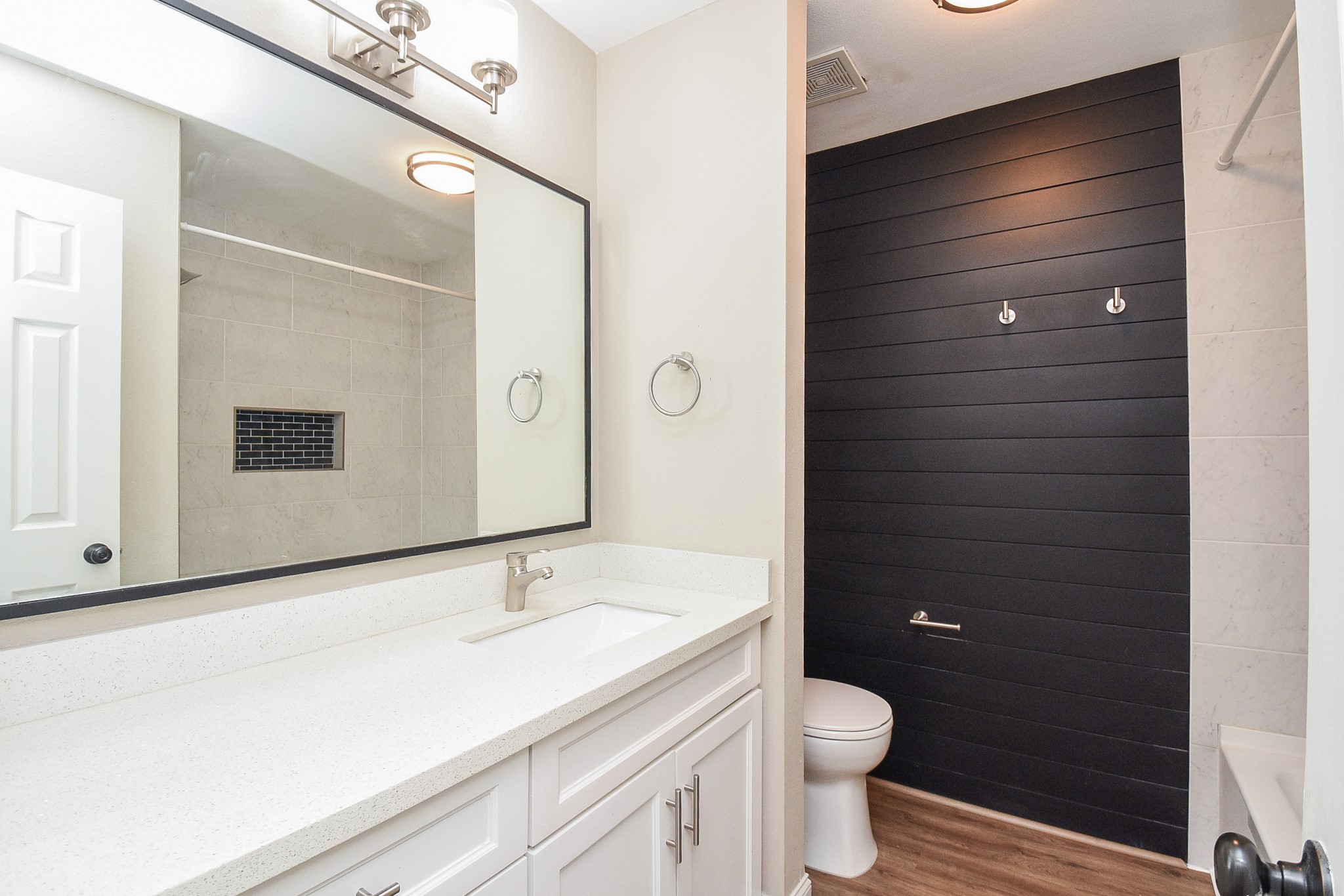 4606 Whispering Rock Lane Spring, TX 77388 - Photo 24 of 30 a bathroom with a granite countertop sink toilet and shower