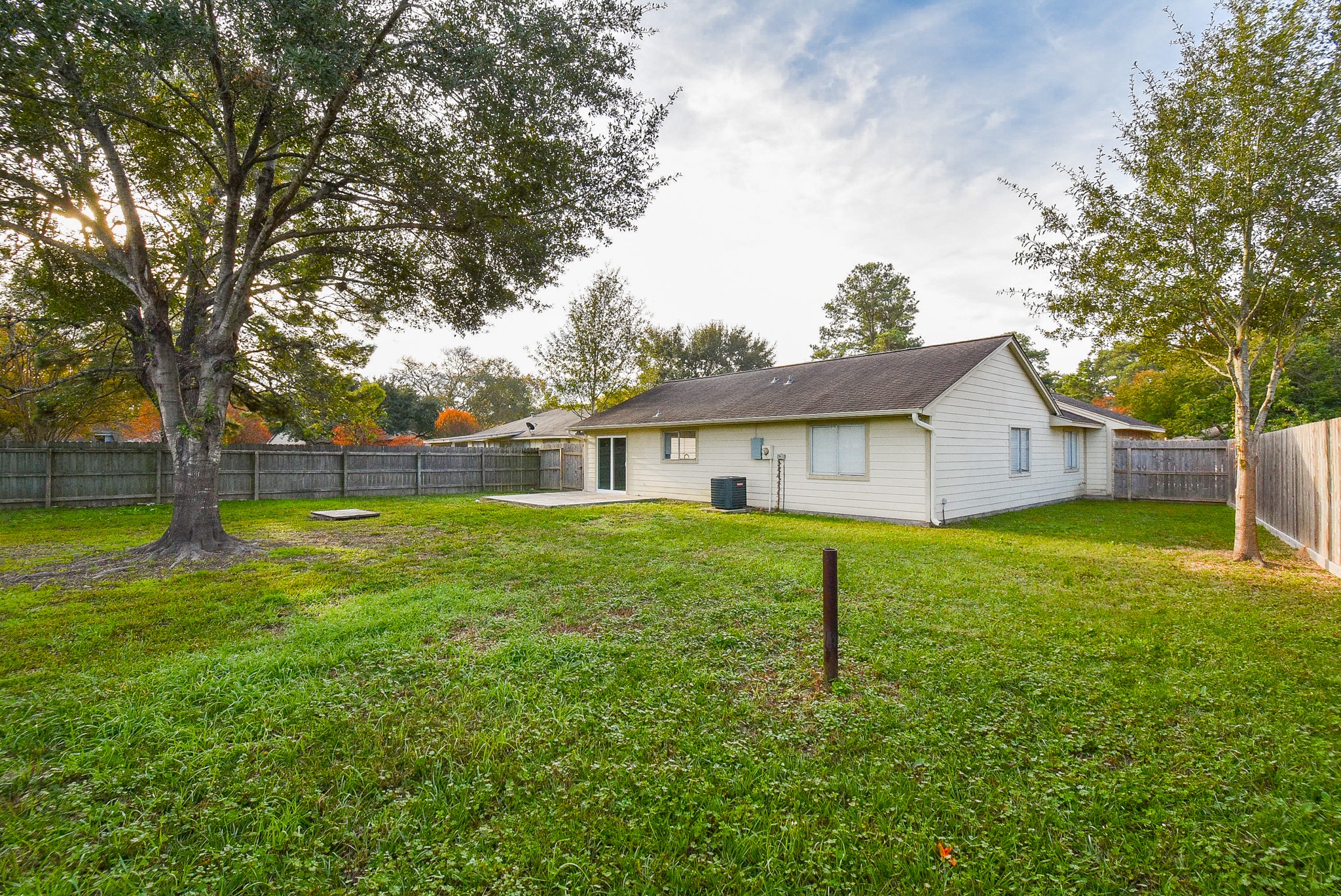 4606 Whispering Rock Lane Spring, TX 77388 - Photo 27 of 30 a view of a house with backyard and a tree