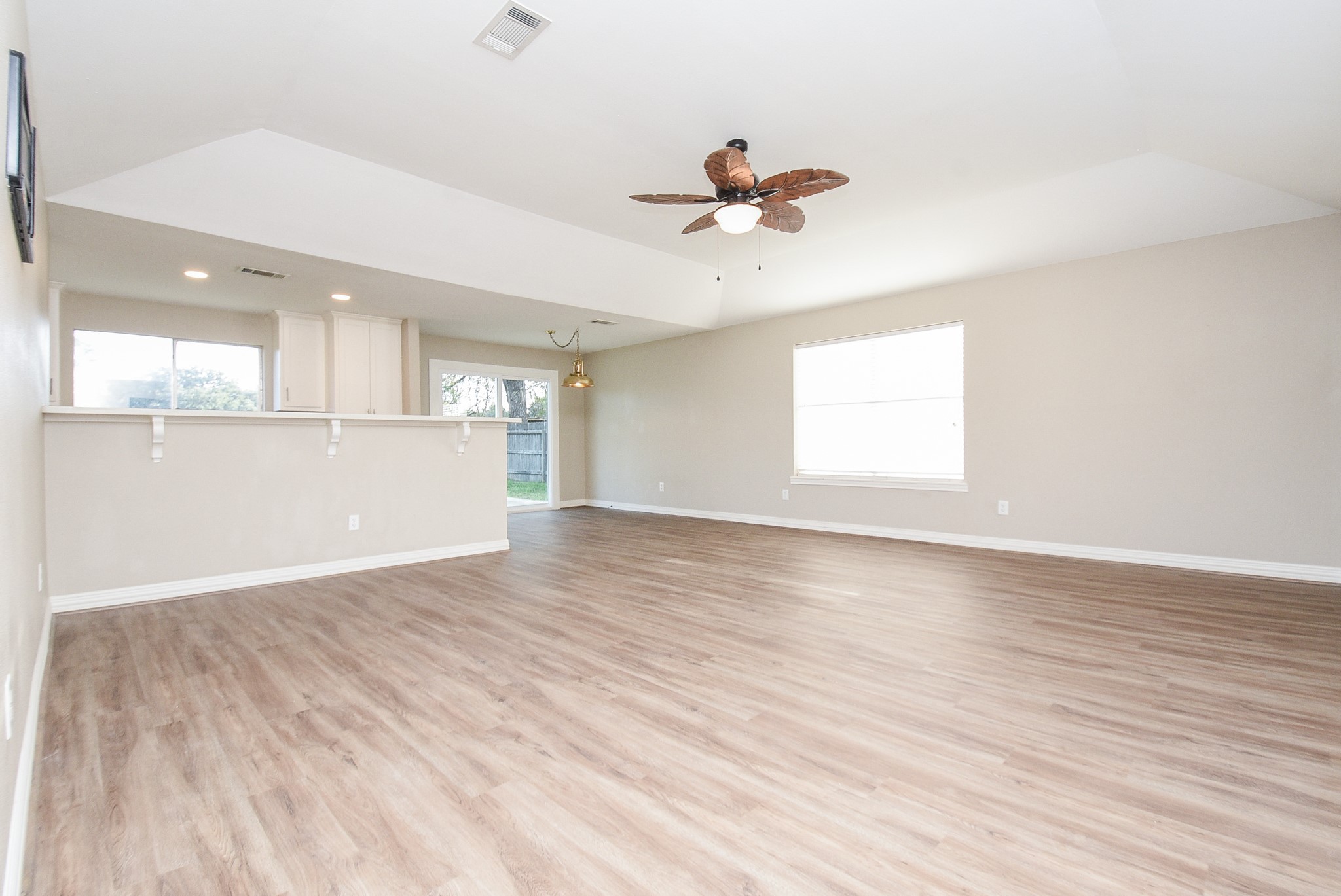 4606 Whispering Rock Lane Spring, TX 77388 - Photo 7 of 30 a view of an empty room with a window and wooden floor