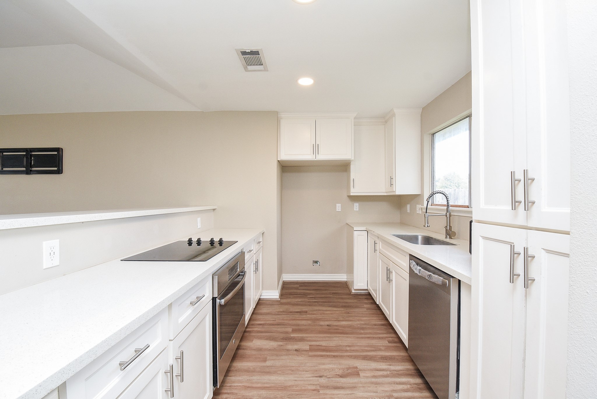 4606 Whispering Rock Lane Spring, TX 77388 - Photo 8 of 30 a kitchen with a sink stove and refrigerator