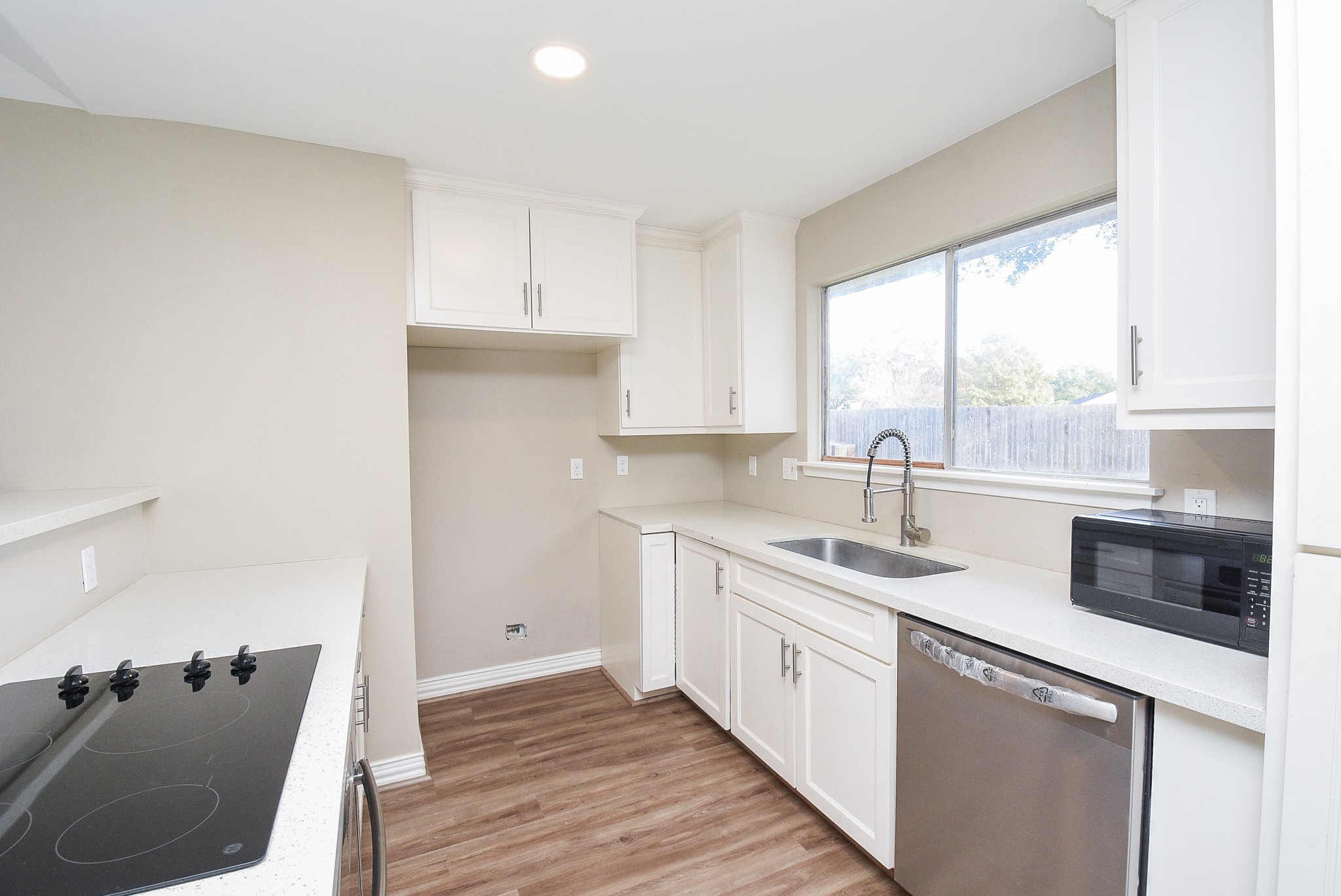 4606 Whispering Rock Lane Spring, TX 77388 - Photo 9 of 30 a kitchen with a sink cabinets and window