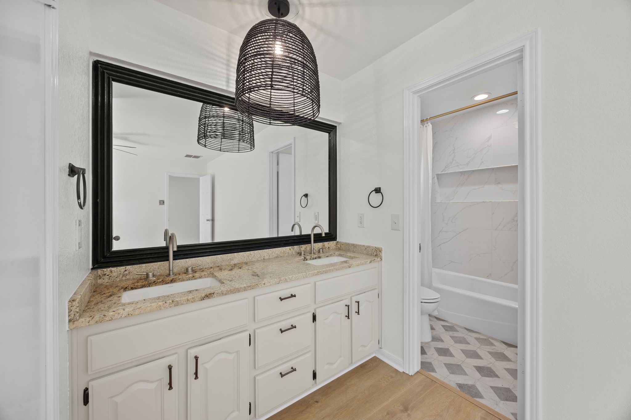 11019 Southwest Oaks Austin, TX 78737 - Photo 18 of 39 The ensuite bath offers a dual granite vanity.